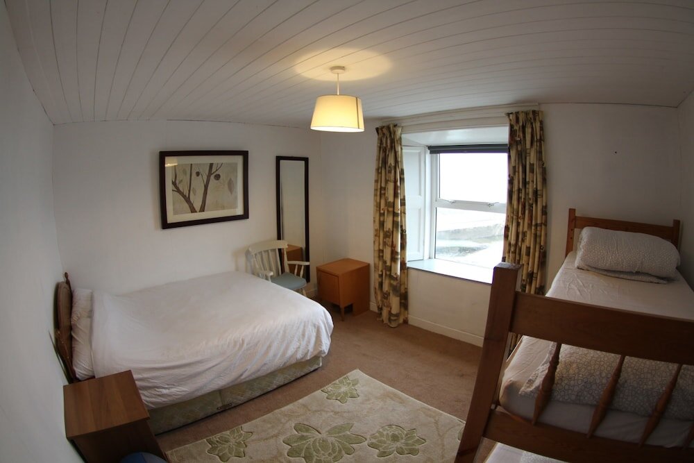 Habitación triple Estándar con vista al mar The Boathouse Lodge Hostel