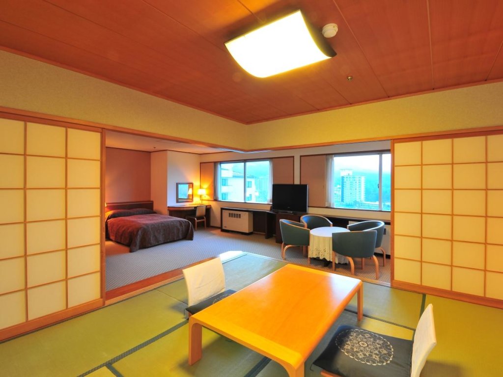 Кровать в общем номере Kusatsu-onsen Hotel Resort