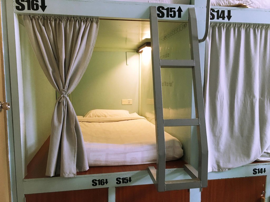 Кровать в общем номере Song of Travel Hostel