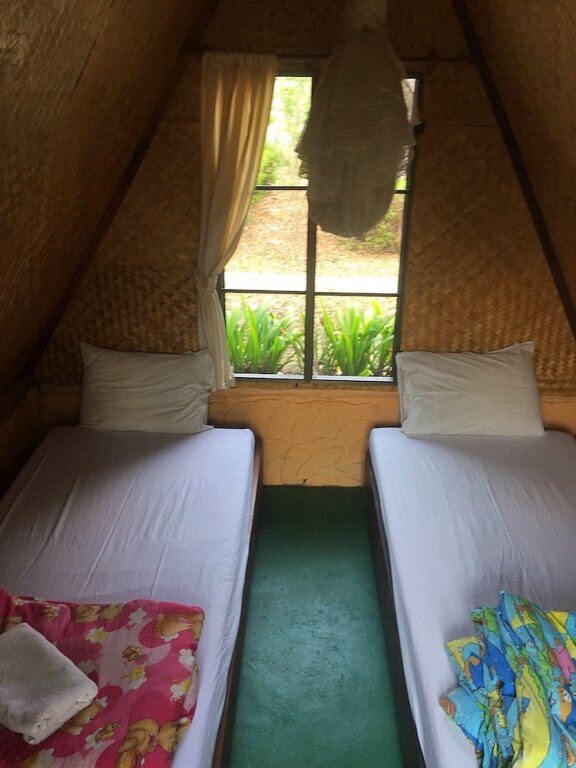 Кровать в общем номере Pai Phu Fah Resort