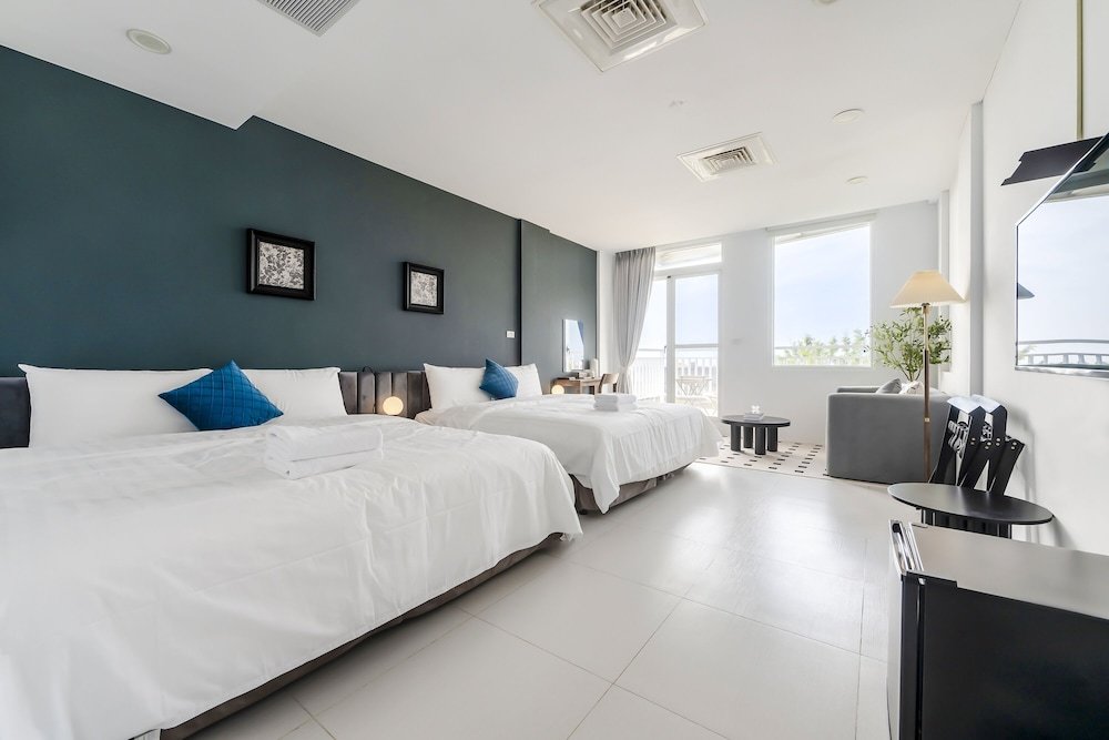 Standard quadruple chambre avec balcon H& Sunset Mu Style Inn