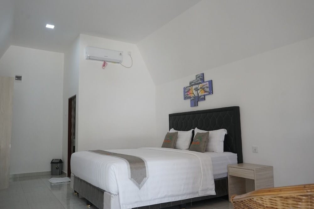 Luxe chambre Madu Tiga Beach & Resort