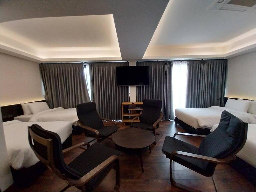 Standard quadruple chambre DUM Hotel - Si Phum