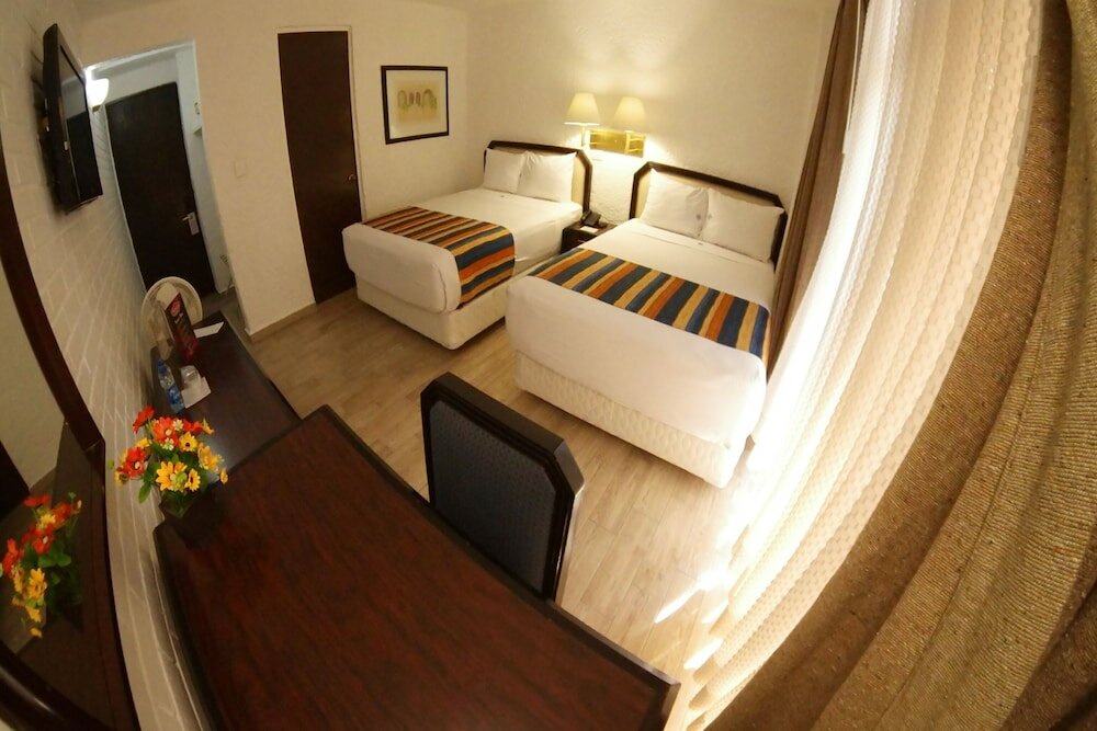 Standard Quadruple room with city view Collection O Hotel Del Portal, Puebla