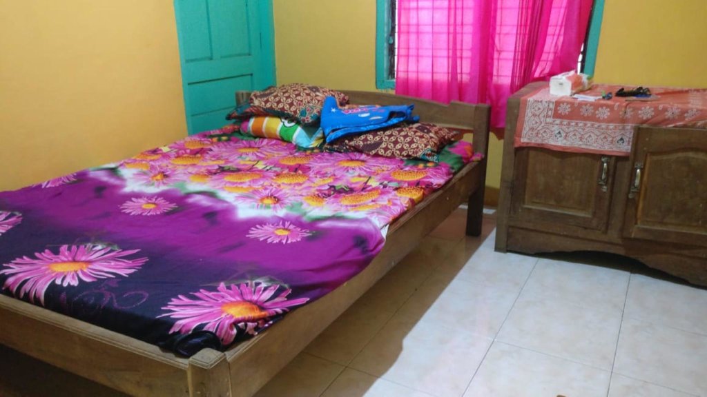 Кровать в общем номере Wahyu Homestay