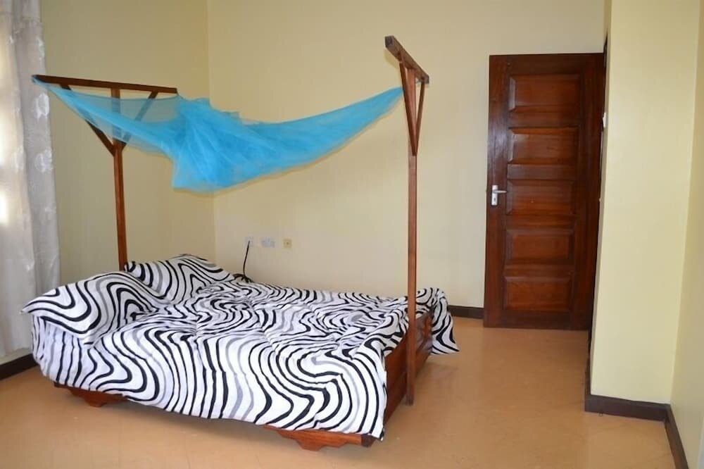 Standard Einzel Zimmer Karibu Tanzania Hostel