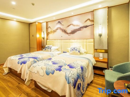 Bett im Wohnheim Hongshan Oxygen Fuyuan Hotel
