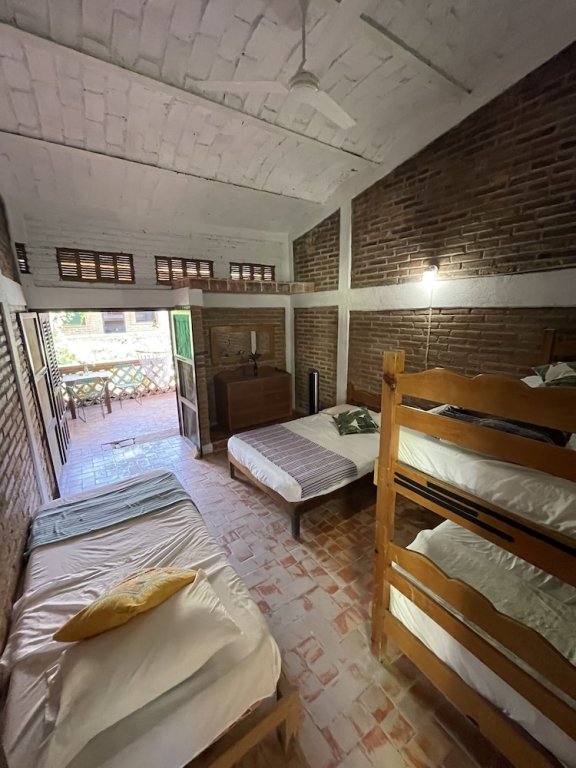 Кровать в общем номере Hosteria Chata Adults Only