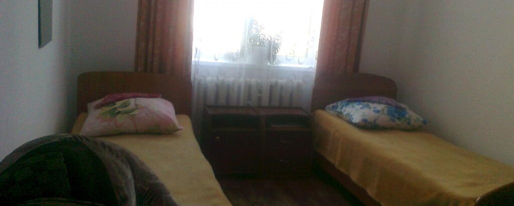 Cama en dormitorio compartido Uyut Hotel