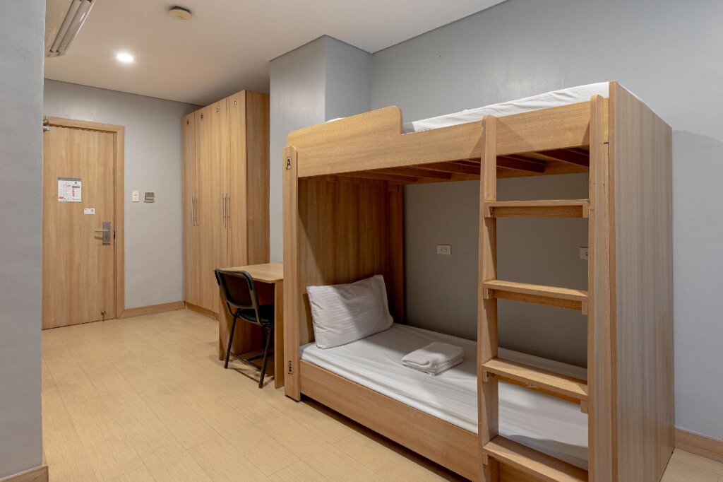 Cama en dormitorio compartido ZEN Rooms Madison 101 QC