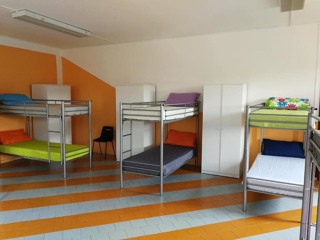 Кровать в общем номере OSTELLO DI SAN GERMANO