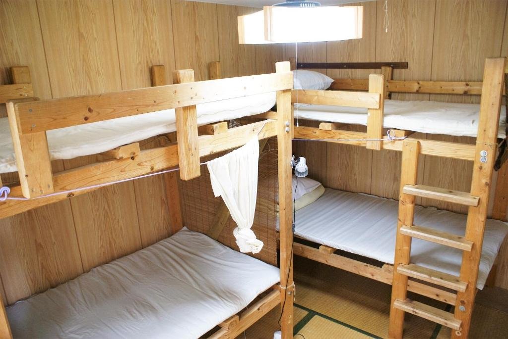 Cama en dormitorio compartido Guest House Agaihama