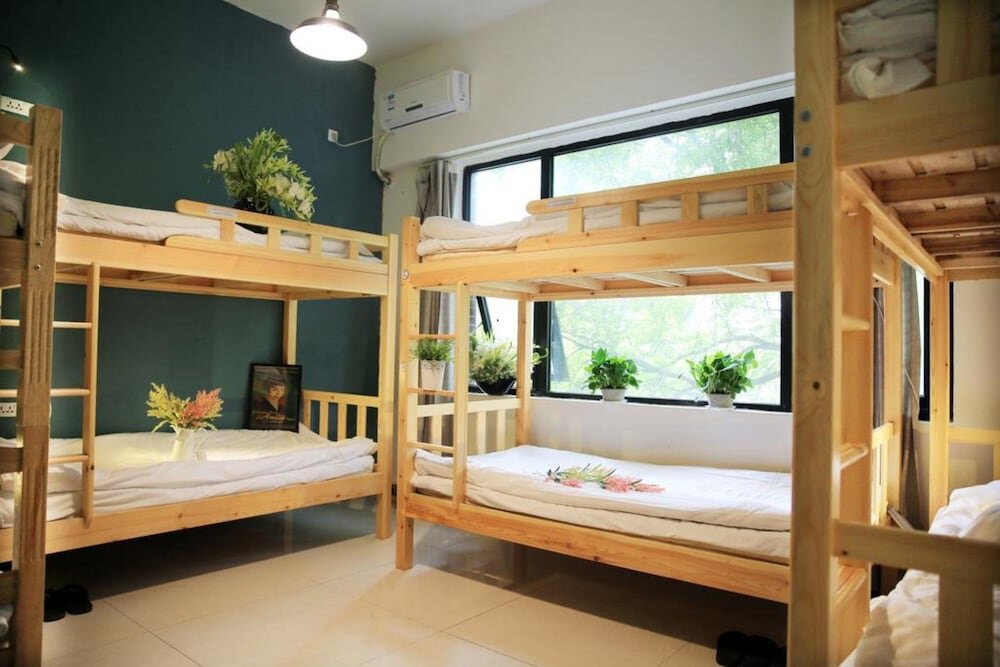 Кровать в общем номере Lohas Dream of Youth Hostel
