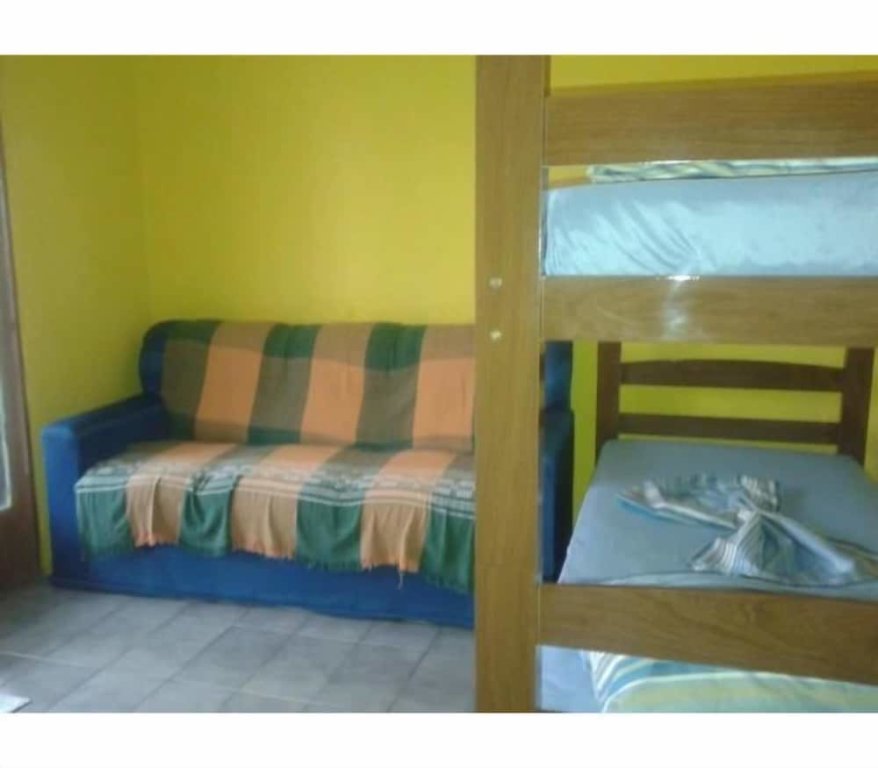 Кровать в общем номере Pousada Alexandrina