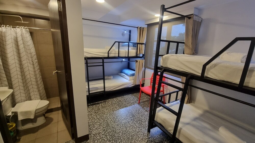 Кровать в общем номере One Cristina Suites