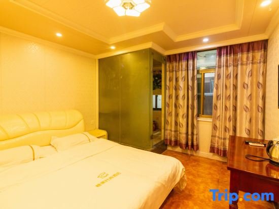 Кровать в общем номере Tangguo Fashion Hotel