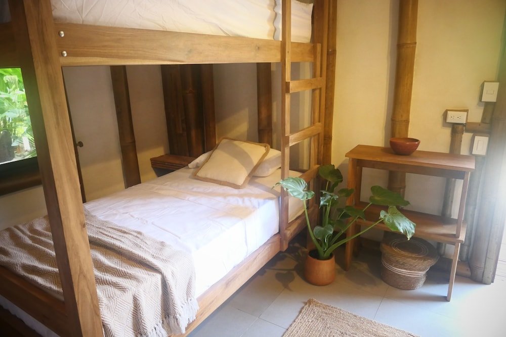 Cama en dormitorio compartido Dream Surf House Santa Teresa