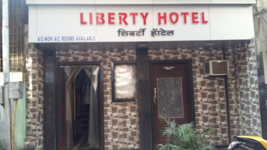 Кровать в общем номере Liberty Hotel