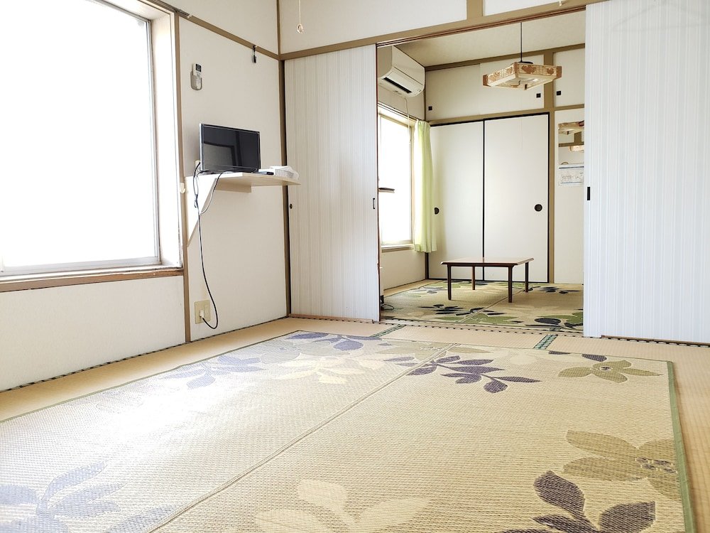 Cama en dormitorio compartido Minshuku Ipponmatsu