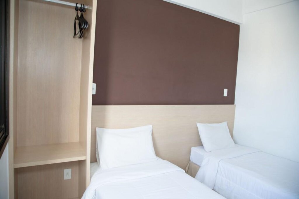 Кровать в общем номере Plaza Inn Trevo Sorocaba