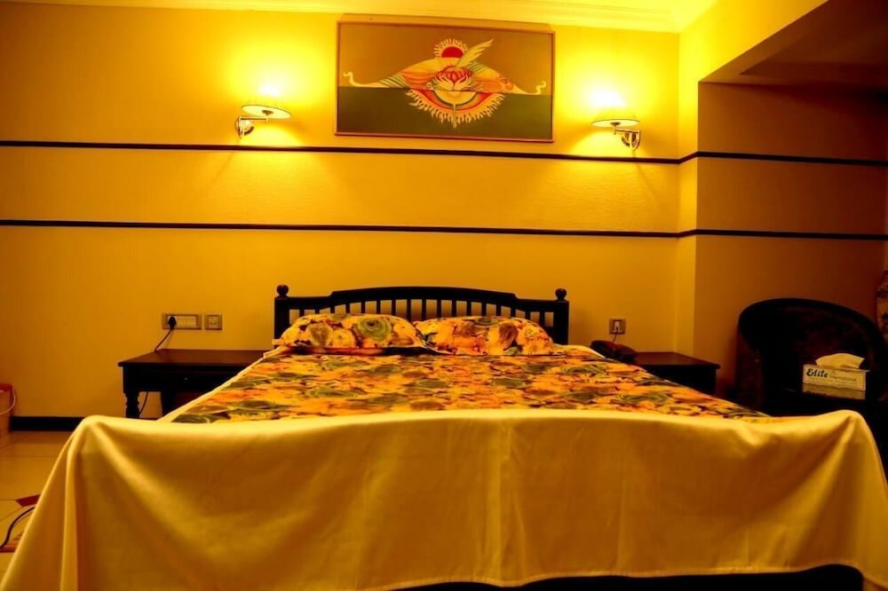 Bett im Wohnheim Hotel Elite International Thrissur