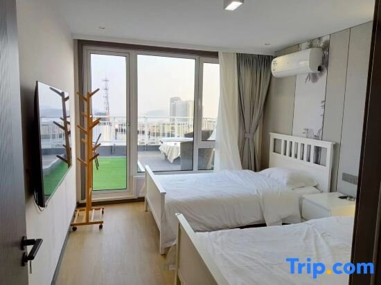 Suite con balcón y con vista al mar Qianhe International Hotel