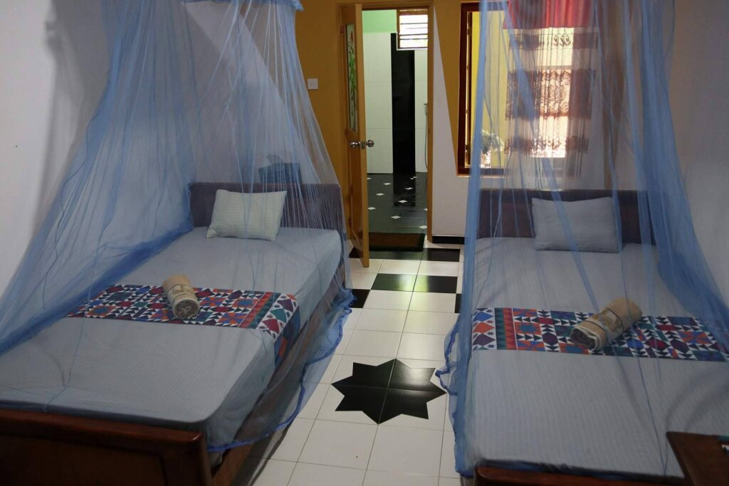 Кровать в общем номере Leopard City Hostel