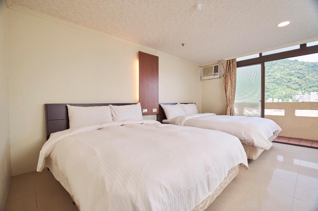 Кровать в общем номере Su Ao Hotel