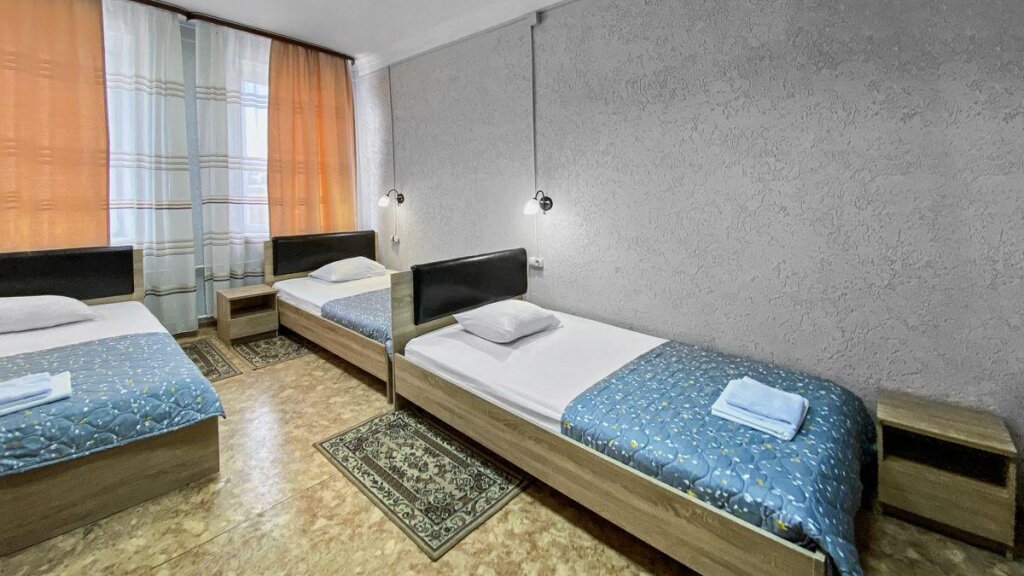 Кровать в общем номере Отель Smart Hotel KDO Абакан