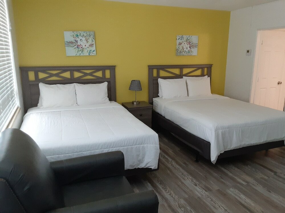 Standard quadruple chambre Sandalwood Beach Resort