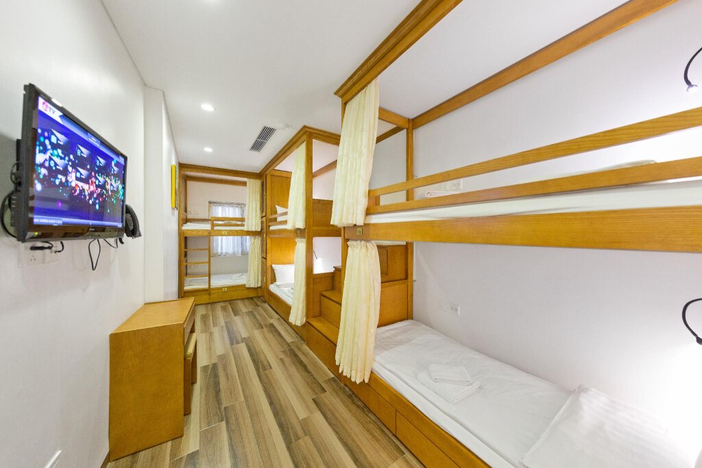 Cama en dormitorio compartido Affa Boutique Hotel