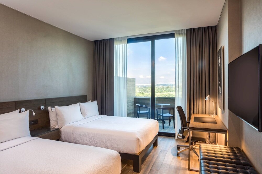 Standard Quadruple room with balcony AC Hotel by Marriott Queretaro Antea