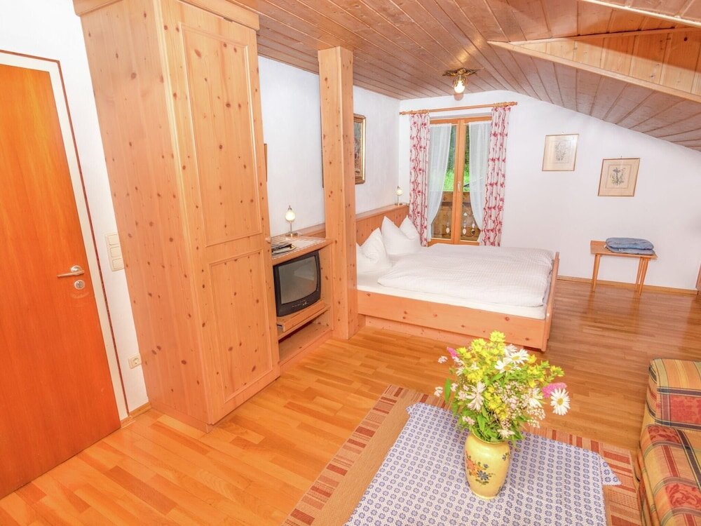 Апартаменты Cosy little holiday home in Chiemgau balcony sauna and swimming pool