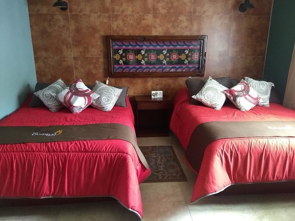 Кровать в общем номере Hotel Las Candelas de Huamantla