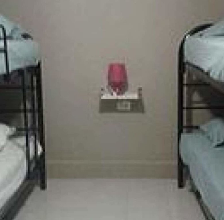 Кровать в общем номере New Century Hostel