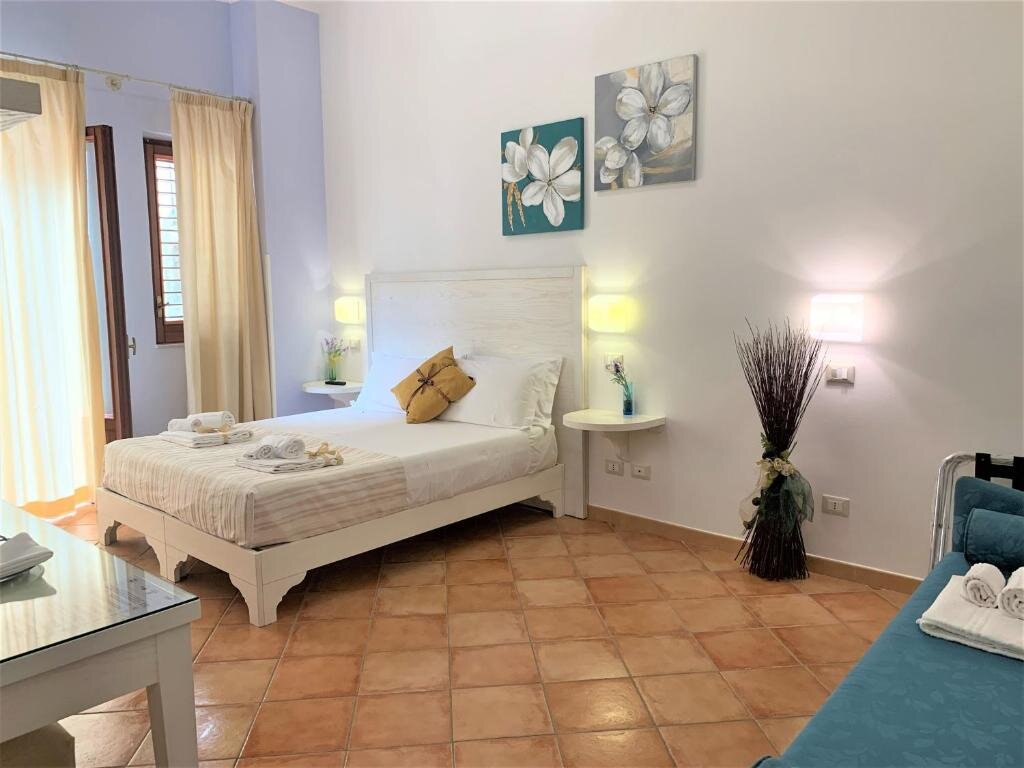 Standard quadruple chambre avec balcon Badia Rooms & Breakfast