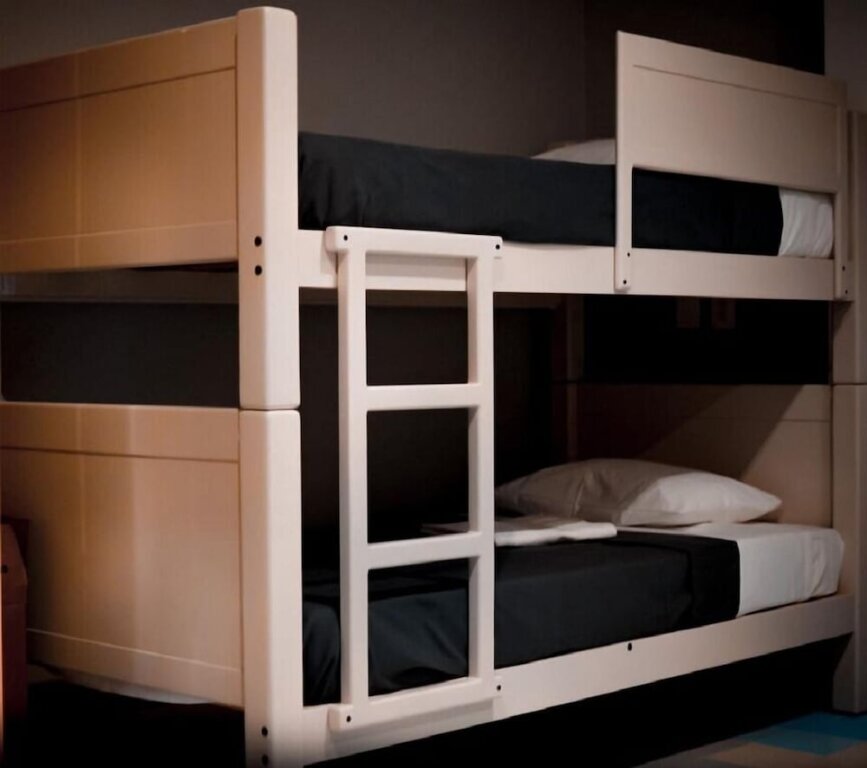 Кровать в общем номере Hostal Nacional by Rotamundos