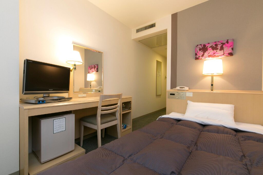 Кровать в общем номере Nagoya Sakae Washington Hotel Plaza