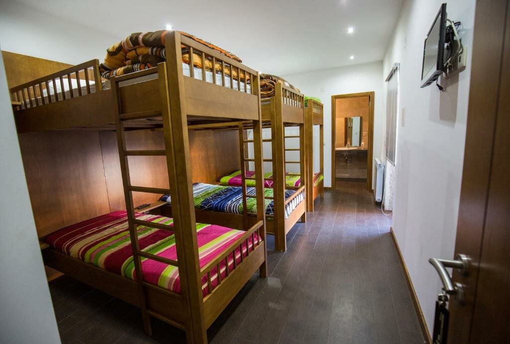 Cama en dormitorio compartido Casa Mirandês Rural