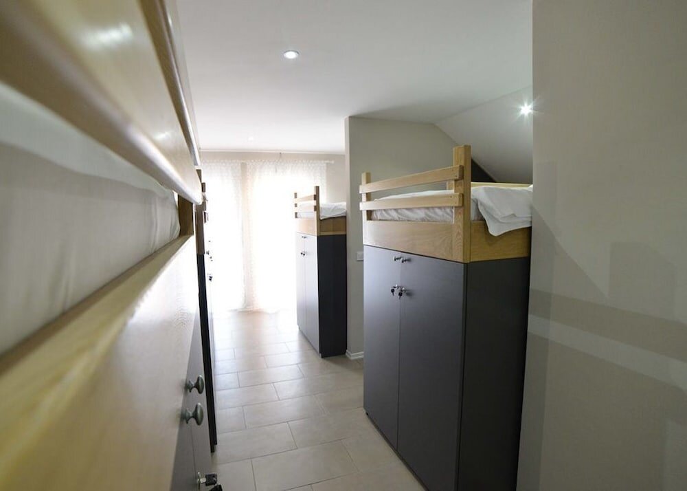 Кровать в общем номере Apartments Choice