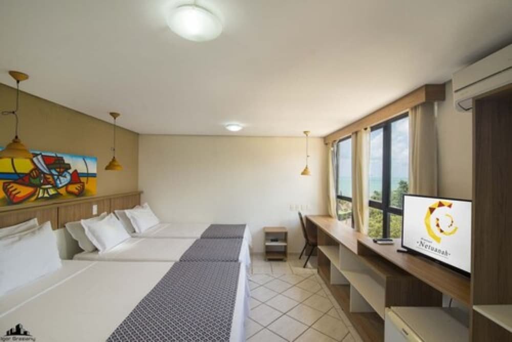 Deluxe triple chambre Netuanah Praia Hotel