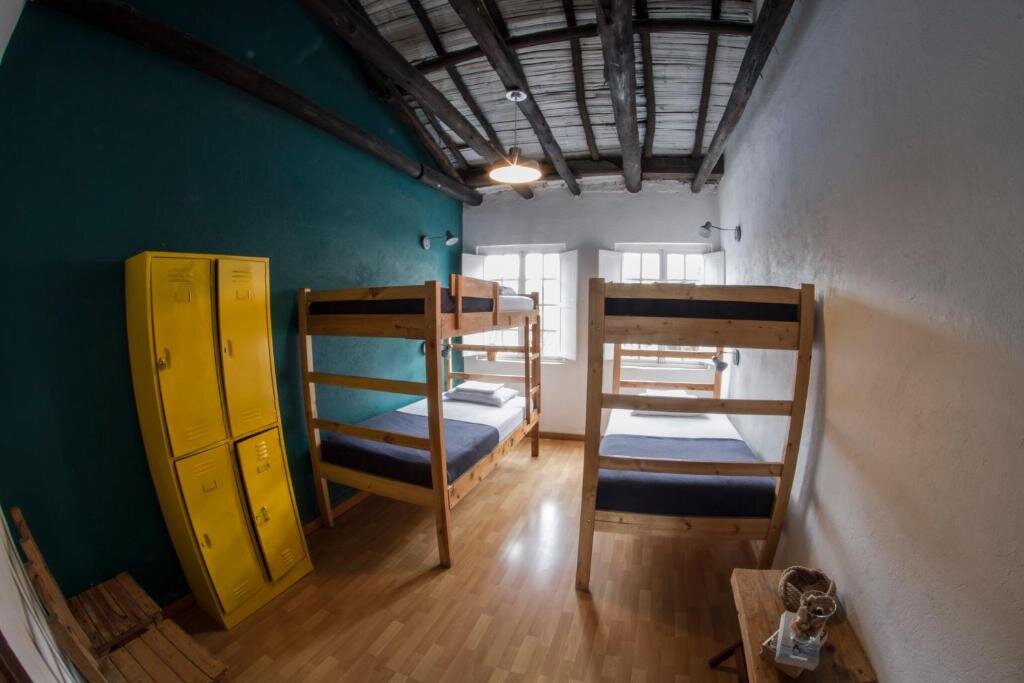 Кровать в общем номере Explora Hostels