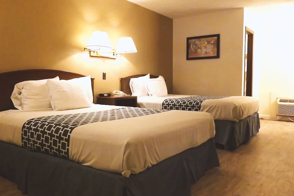 Standard Quadruple room Coratel Inn & Suites