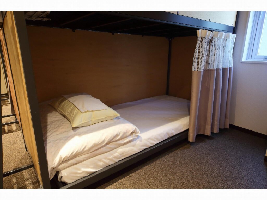 Кровать в общем номере Bakery Hotel Chateau D'or
