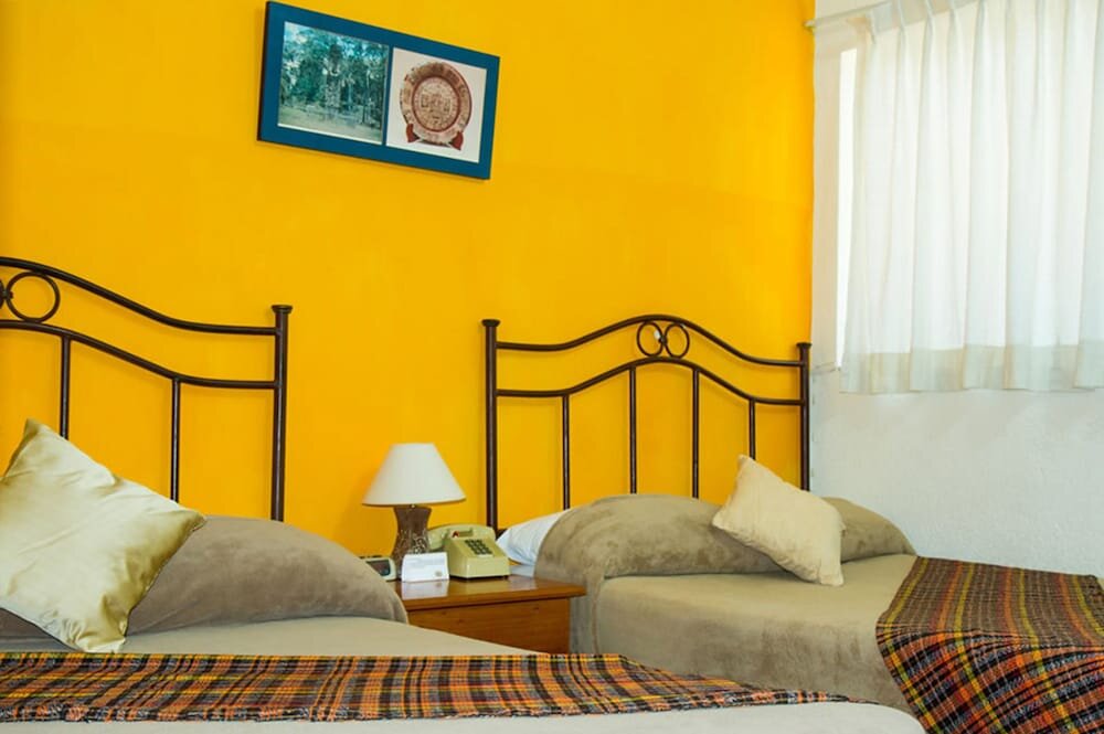 Четырёхместный номер Standard Hotel Casa Flores de Tikal