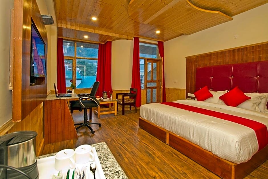 Standard room with balcony Sarthak Regency Centrally Heated & Air cooled, Rangri, Manali,HP,Just 1 kms from Volvo parking