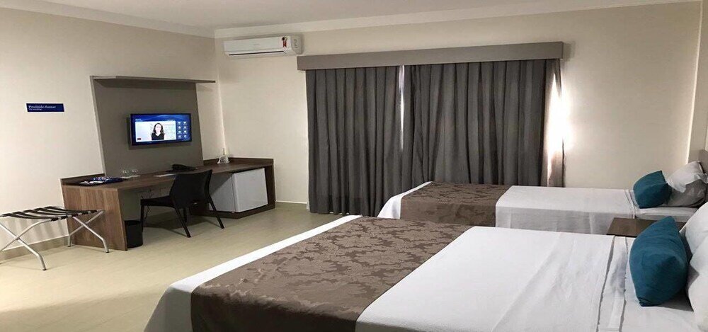 Standard triple chambre Racini Suites Hotel
