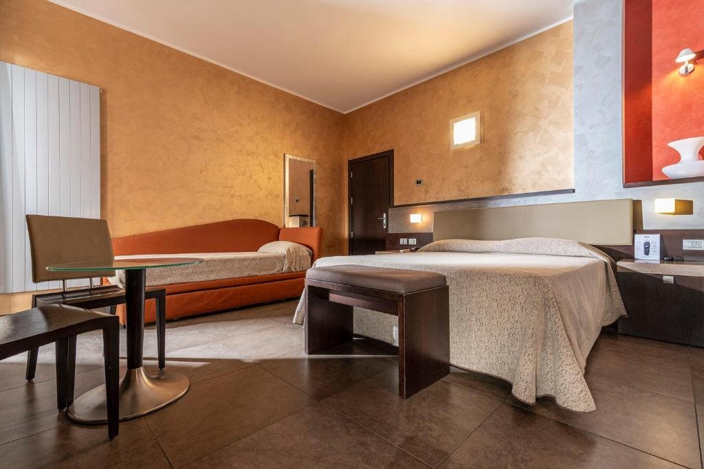 Standard Quadruple room with balcony Hotel Dei Nani