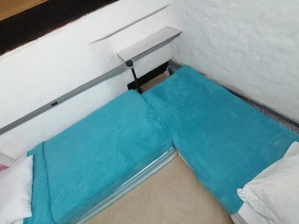 Кровать в общем номере Hostel la Antigua Capsula