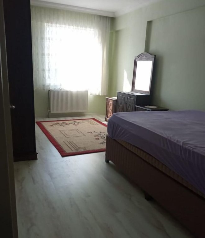 Cama en dormitorio compartido İlyada Pansiyon